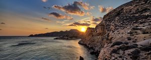 Preview wallpaper sea, rocks, sunset, coast, evening, landscape