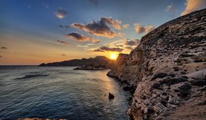Preview wallpaper sea, rocks, sunset, coast, evening, landscape