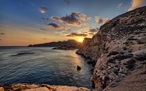 Preview wallpaper sea, rocks, sunset, coast, evening, landscape