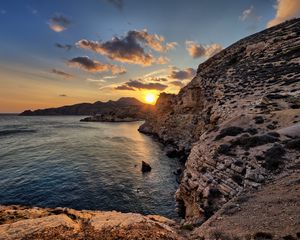 Preview wallpaper sea, rocks, sunset, coast, evening, landscape