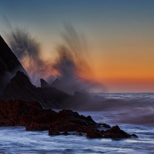 Preview wallpaper sea, rocks, surf, waves, sunset