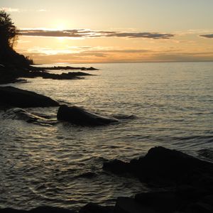 Preview wallpaper sea, rocks, twilight, dark