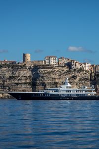 Preview wallpaper sea, ship, rocks, buildings