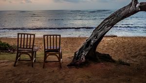 Preview wallpaper sea, shore, chairs, view, twilight, landscape