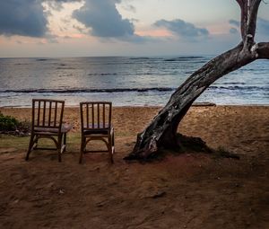 Preview wallpaper sea, shore, chairs, view, twilight, landscape
