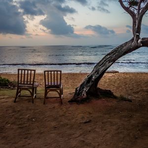 Preview wallpaper sea, shore, chairs, view, twilight, landscape