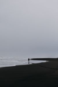 Preview wallpaper sea, silhouette, loneliness, lonely, surf