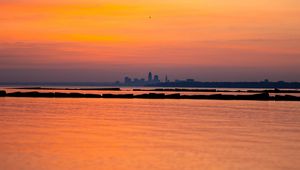 Preview wallpaper sea, silhouettes, city, evening