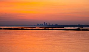 Preview wallpaper sea, silhouettes, city, evening