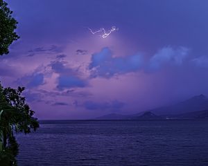 Preview wallpaper sea, sky, lightning, mountains, landscape, nature