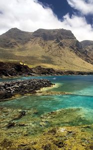 Preview wallpaper sea, sky, mountains, grass, landscape, summer