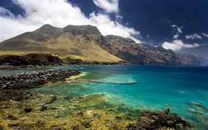 Preview wallpaper sea, sky, mountains, grass, landscape, summer