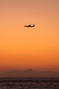 Preview wallpaper sea, sky, plane, island, dusk