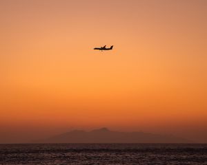 Preview wallpaper sea, sky, plane, island, dusk