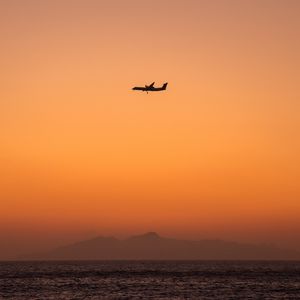 Preview wallpaper sea, sky, plane, island, dusk
