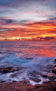 Preview wallpaper sea, sky, sunset, clouds, rocks, surf