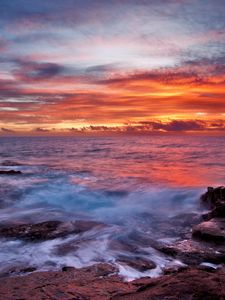 Preview wallpaper sea, sky, sunset, clouds, rocks, surf