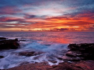 Preview wallpaper sea, sky, sunset, clouds, rocks, surf