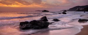 Preview wallpaper sea, stone, waves, coast, horizon, sunset