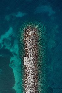 Preview wallpaper sea, stones, aerial view, breakwater, water