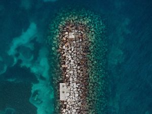 Preview wallpaper sea, stones, aerial view, breakwater, water