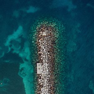 Preview wallpaper sea, stones, aerial view, breakwater, water