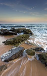 Preview wallpaper sea, stones, beach, horizon, tide