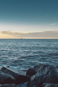 Preview wallpaper sea, stones, boat, horizon