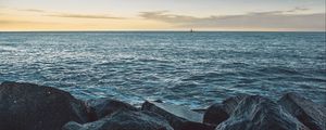 Preview wallpaper sea, stones, boat, horizon