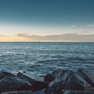 Preview wallpaper sea, stones, boat, horizon