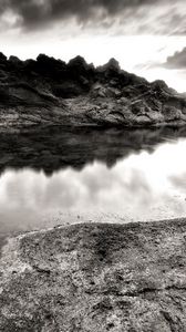 Preview wallpaper sea, stones, coast, rocks, despondency, black-and-white