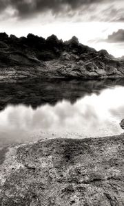 Preview wallpaper sea, stones, coast, rocks, despondency, black-and-white