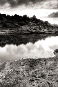 Preview wallpaper sea, stones, coast, rocks, despondency, black-and-white