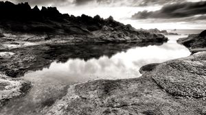 Preview wallpaper sea, stones, coast, rocks, despondency, black-and-white