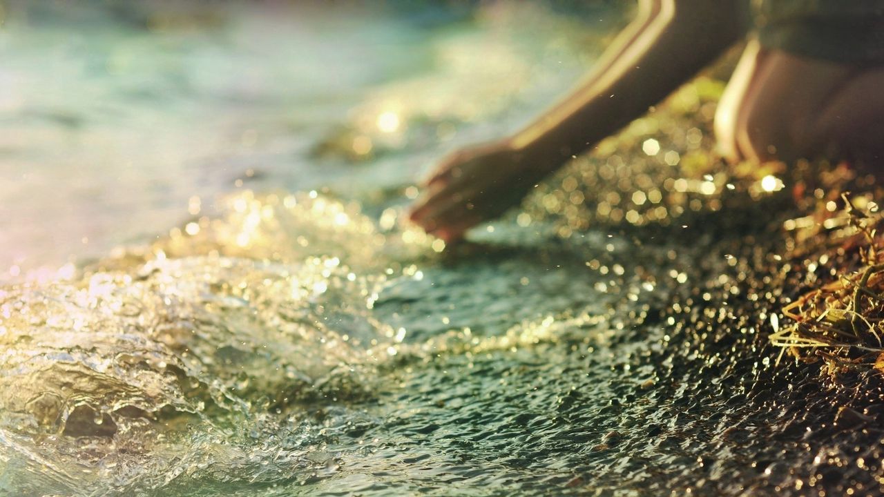 Wallpaper sea, stones, gravel, lights, glitter, hand, arm