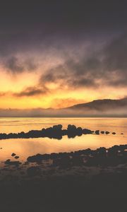 Preview wallpaper sea, stones, hills, clouds, evening
