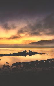 Preview wallpaper sea, stones, hills, clouds, evening