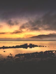 Preview wallpaper sea, stones, hills, clouds, evening