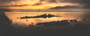Preview wallpaper sea, stones, hills, clouds, evening