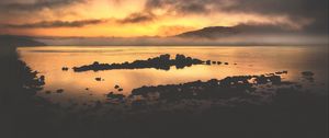 Preview wallpaper sea, stones, hills, clouds, evening