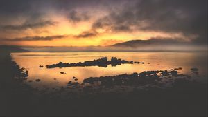 Preview wallpaper sea, stones, hills, clouds, evening