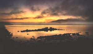 Preview wallpaper sea, stones, hills, clouds, evening