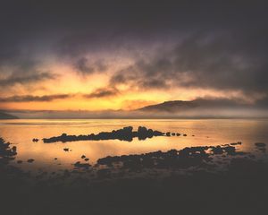 Preview wallpaper sea, stones, hills, clouds, evening