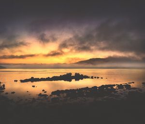 Preview wallpaper sea, stones, hills, clouds, evening