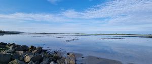 Preview wallpaper sea, stones, horizon, clouds, sky, nature