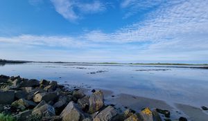 Preview wallpaper sea, stones, horizon, clouds, sky, nature