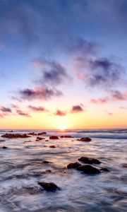 Preview wallpaper sea, stones, horizon, sunset, clouds, nature