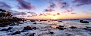 Preview wallpaper sea, stones, horizon, sunset, clouds, nature