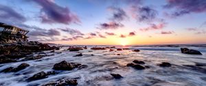 Preview wallpaper sea, stones, horizon, sunset, clouds, nature