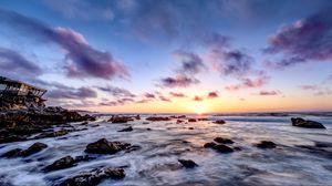 Preview wallpaper sea, stones, horizon, sunset, clouds, nature